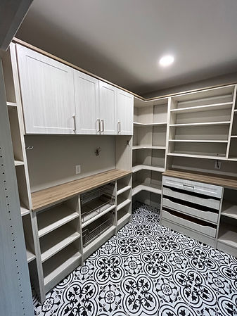 Custom Pantry with fridge surround, doors, drawers, baskets, hooks, corner shelves, and more.
