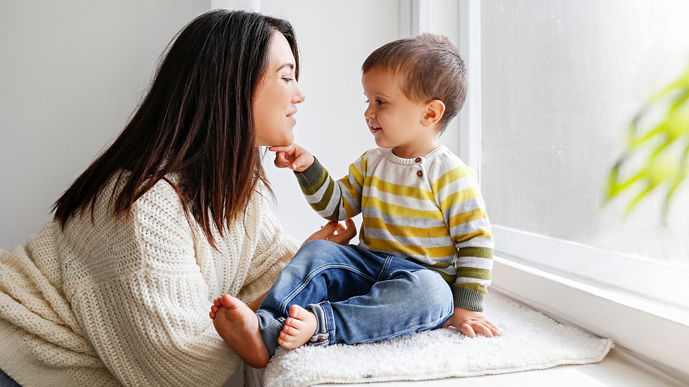 Mother and toddler bonding by a window, illustrating the importance of setting clear and consistent boundaries. This image reflects how toddlers thrive with routine and structure, helping them feel secure, reduce anxiety, and minimize tantrums