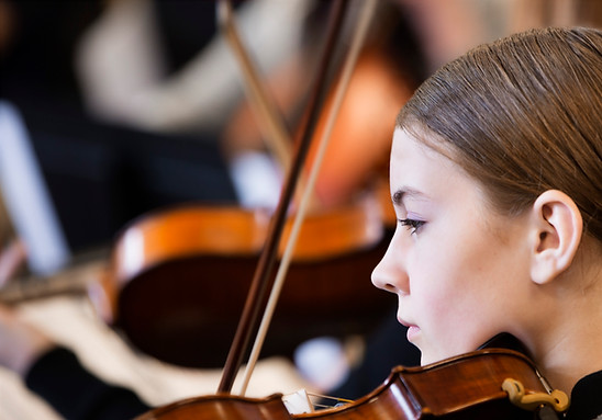 Young girl playing a violin