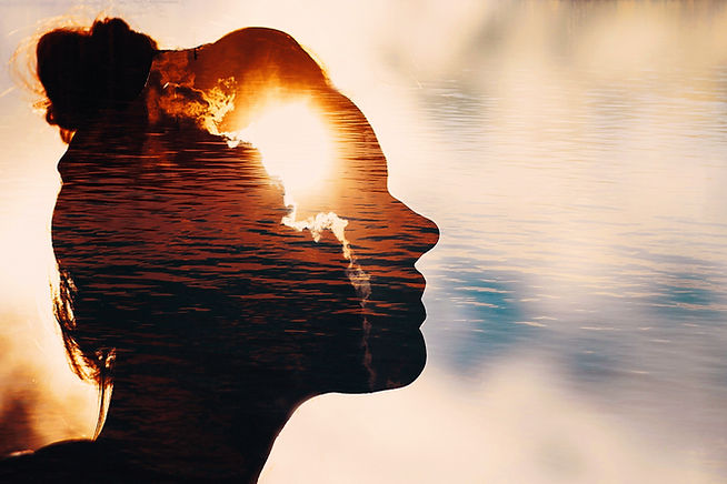 Sun peeks out from behind the clouds in woman's head..jpg