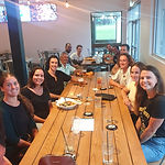A group of people sitting at a large table