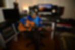 Photo of a child playing a guitar