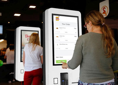 Interactive touch screen kiosk, in use in hospitality application.
