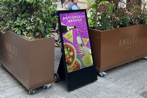 High brightness outdoor battery A-board display, hospitality application example.