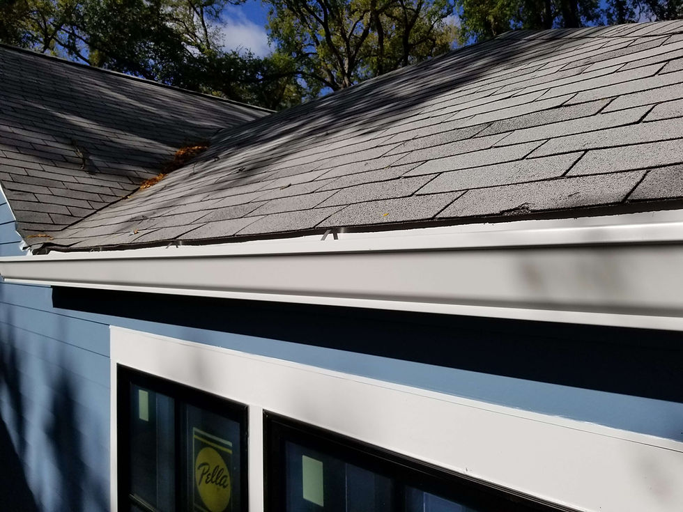 White 6 inch K style gutters on shingle roof