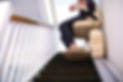 detail-of-senior-woman-sitting-on-stair-lift-at-home-to-help-mobility-135607519.jpg