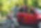 young-man-helping-disabled-senior-woman-in-wheelchair-to-get-into-car-160212321.jpg