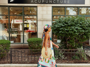 walking in summer outfit in front of moon rabbit acupuncture west loop location