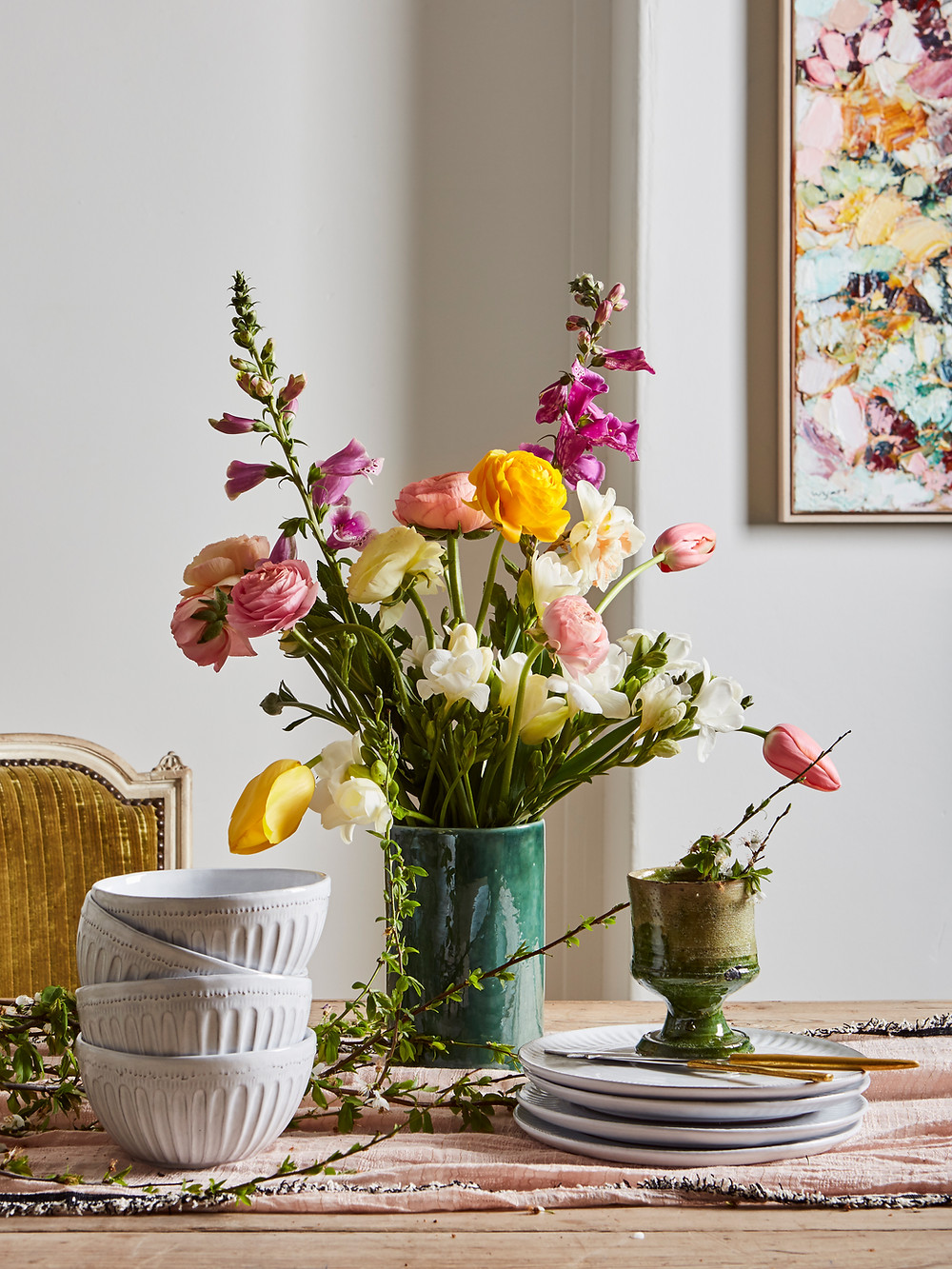 vase with loose floral table setting