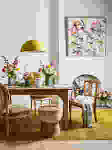 dining room with florals and art yellow tones
