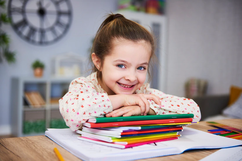 smiling-girl-studying-home_329181-18968.webp