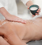 shot-of-a-woman-having-a-salt-scrub-rubbed-into-he-2025-04-06-08-24-54-utc.jpg
