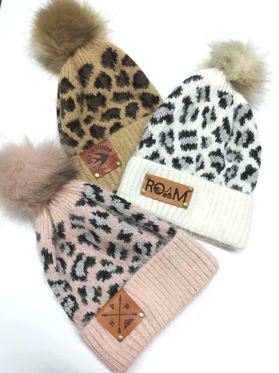 Super soft cheetah/leopard print beanie with pom with Firebranded leather patch