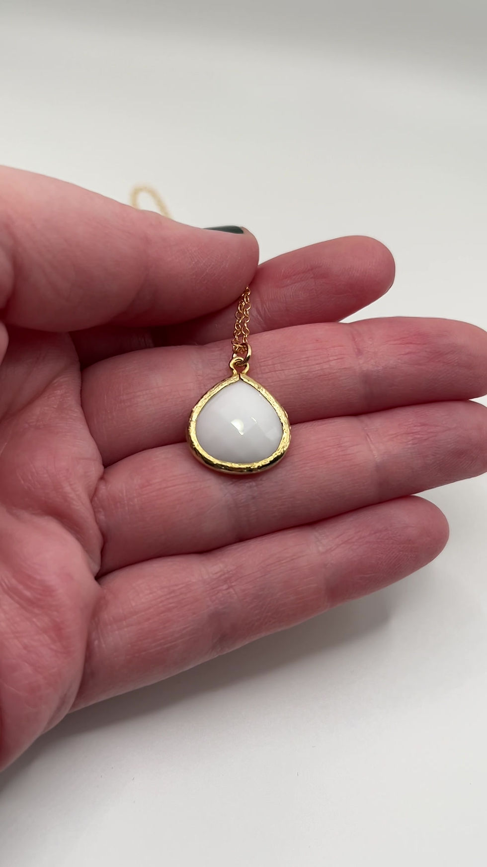 Thumbnail: White Glass Drop Short Gold Necklace