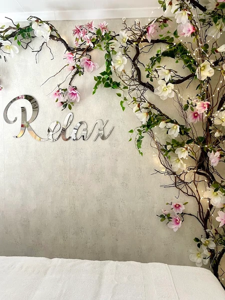 Large artificial tree display with cascading vines