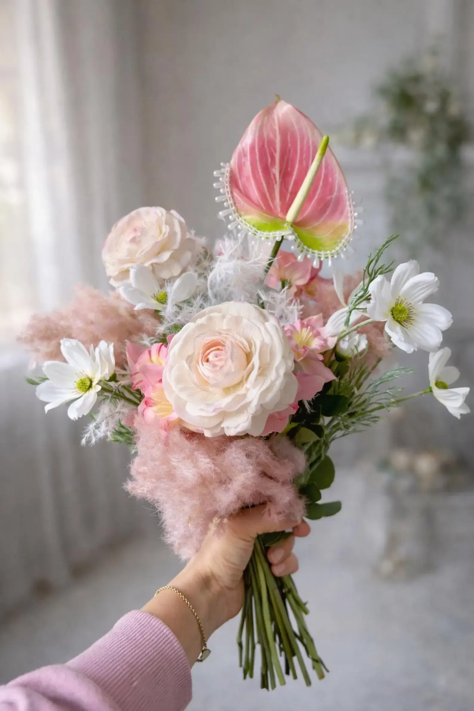 Blush pink anthurium bridal bouquet with beaded detail and pastel faux wedding flowers