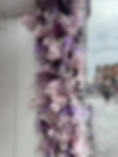artificial pink and lilac flower garlands for window display