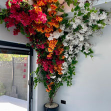 residential artificial flower installations featuring bespoke faux floral arches, hallway displays, pergolas, entranceways and luxury home decor