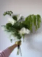 Luxury faux anthurium bouquet with sculptural greenery and cascading amaranthus in modern asymmetrical design