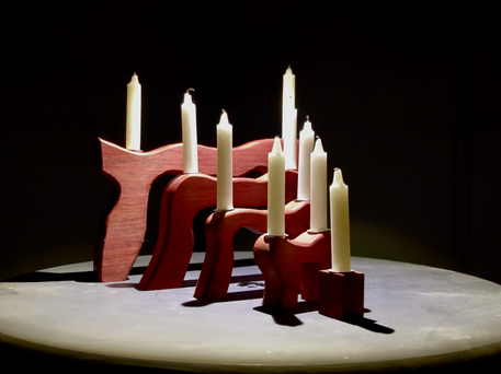 Handcrafted menorah carved from exotic hardwood in the Hebrew symbol for life