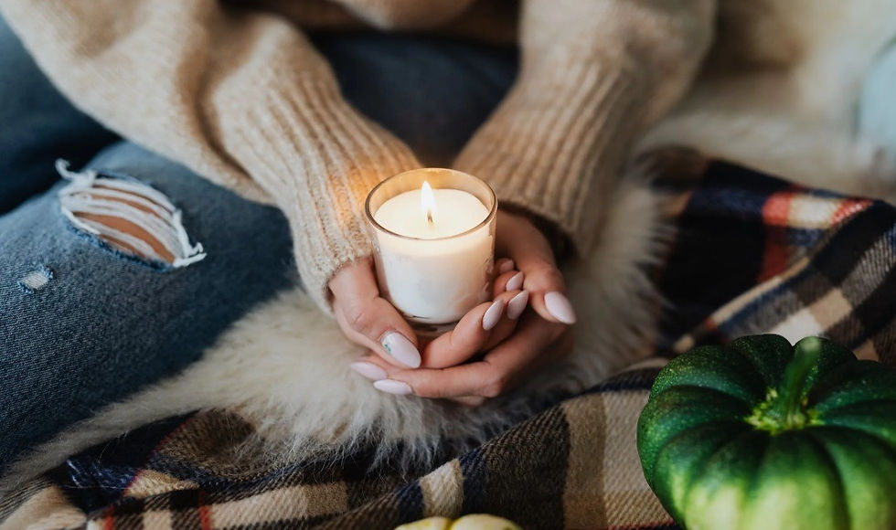 woman holding candle in winter