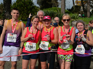 Runners with their finish medals at the end of the Run Falmouth Half Marathon