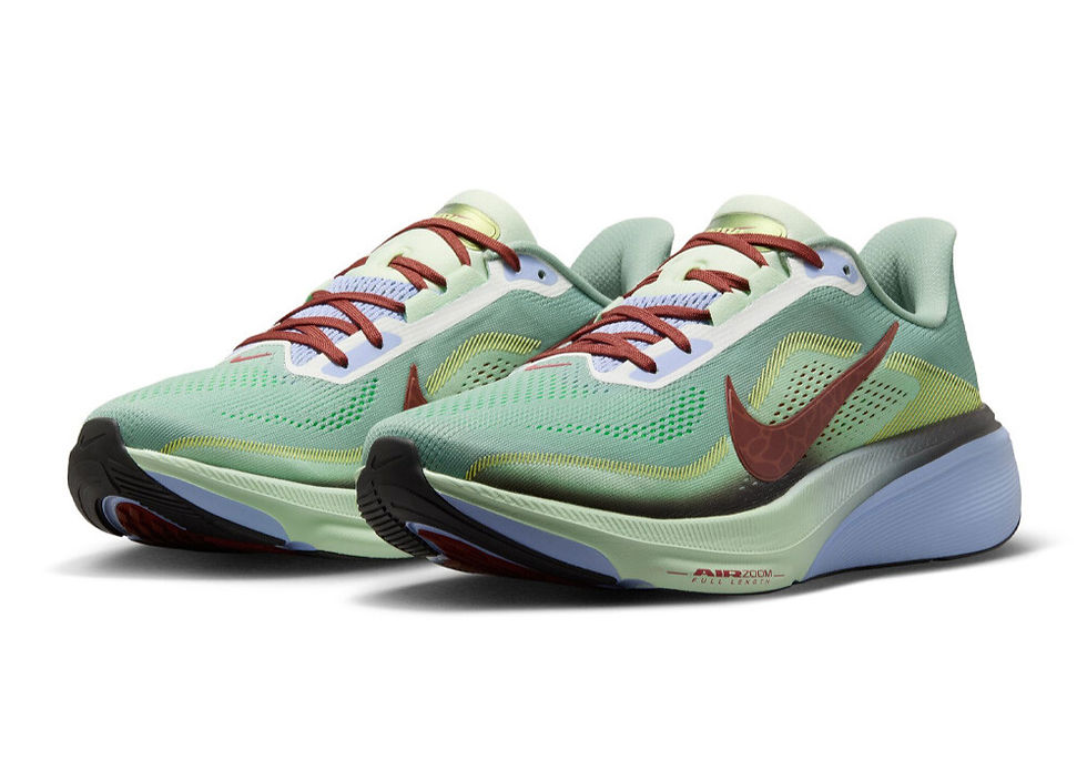 Pair of mint green Nike running shoes with maroon laces and swooshes on a white background, showing Air Zoom text.