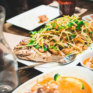 Two dishes of food on a table