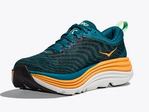 Blue and orange athletic shoe with wavy patterns, shown on a plain white background. Sole is thick with yellow and white layers.