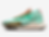 Turquoise Nike sneaker with brown sole and orange laces. Features GORE-TEX label and red swoosh logo, set against a white background.