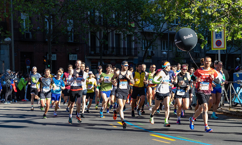 Madrid Marathon runners racing through the streets of central Madrid, Spain.