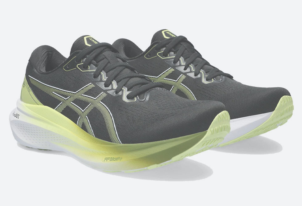 Black and neon green Asics running shoes with a sleek design, featuring prominent logos. Light grey background enhances the shoe colours.