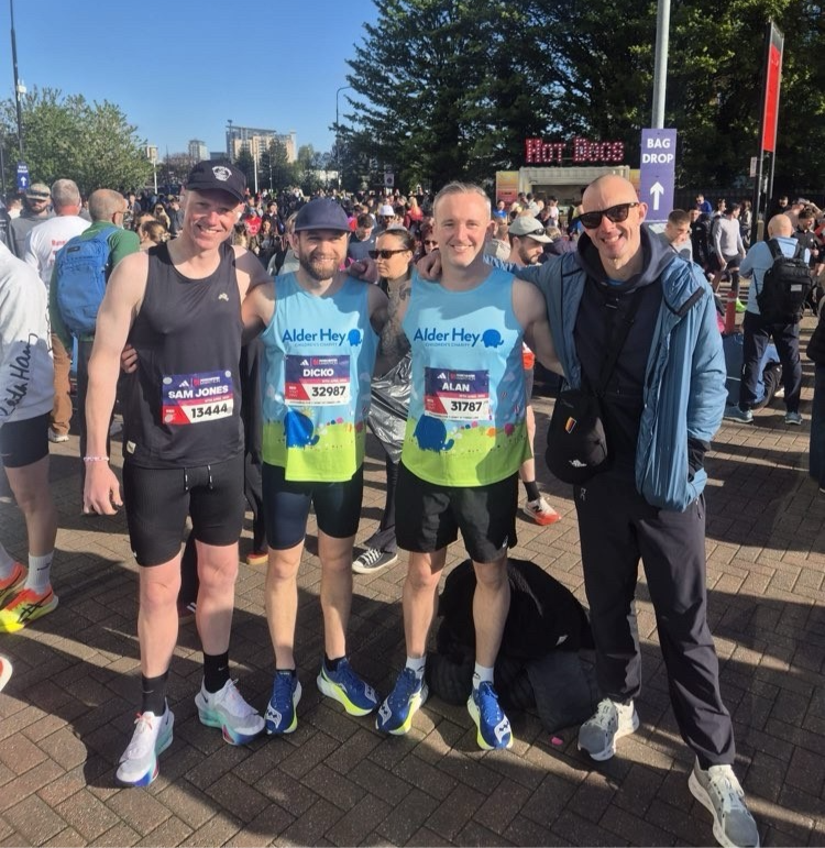 Adam Dixon and friends at the start of the Manchester Marathon. Bright blue sky.