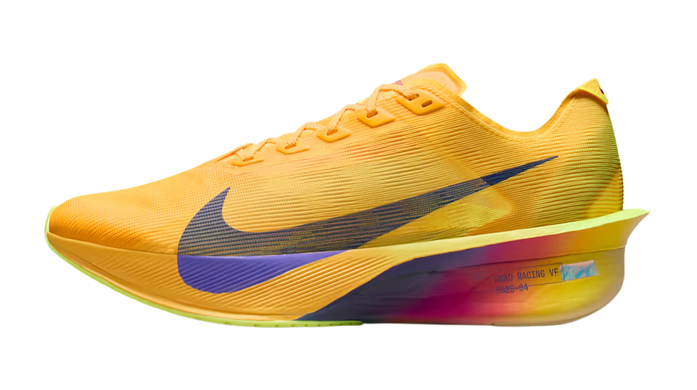Yellow-orange Nike Vaporfly 4 running shoe with blue swoosh on black background; side text reads ROAD RACING VF.