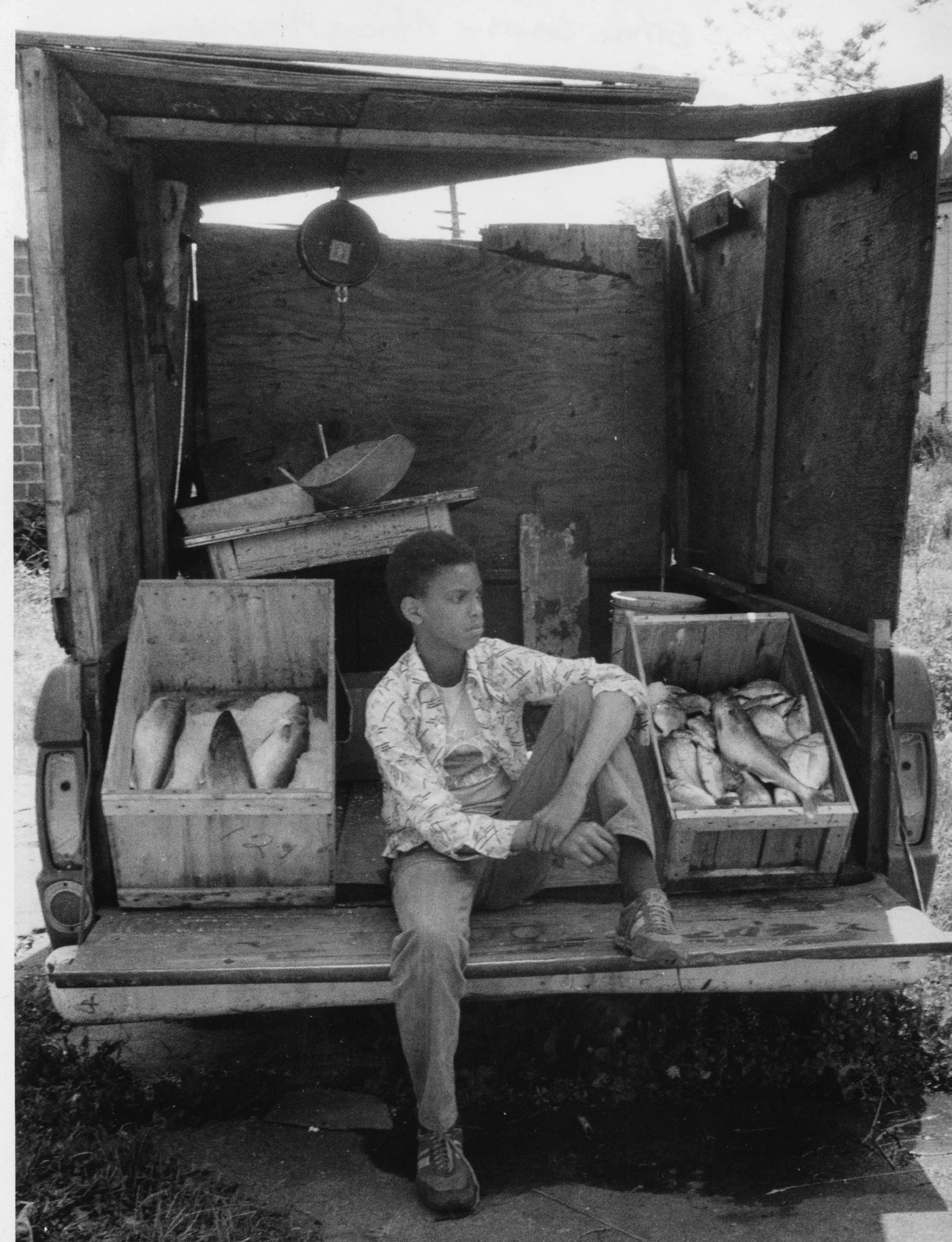 Youth selling fish