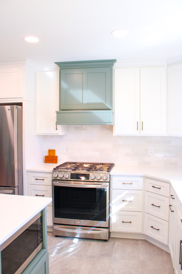 Dappled sunlight adds a cheery effect to the Sage Green Kitchen by Barrett Home Renovations 
