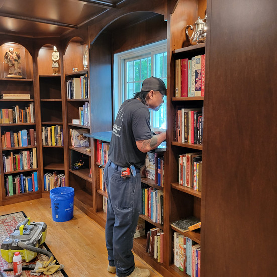 Expert fabricator installing marble window ledge