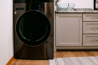 Oak floors are stained and sealed in the Elvis & Jackie Half Bath