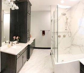 Primary bath imbued in porcelain and featuring Amish wood double vanity with bump out