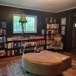 Leg lamp in front of large picture window and personal items ready to find a temporary place before demolition 