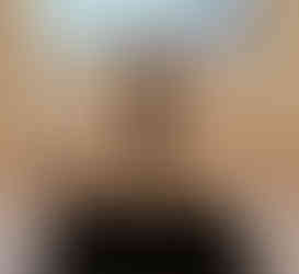 Close up of glass washing gadget at sink area featuring hands free rubbed bronze faucet