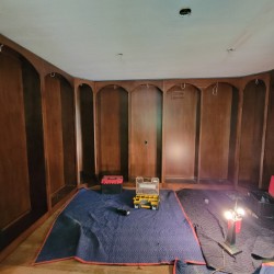 New library wall-to-wall book cases have custom arches