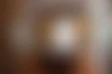 Before, dark cabinetry with heavy floating lighting feature