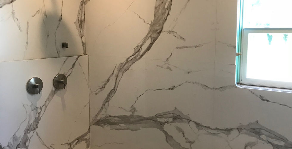 Vein matching polished porcelain in shower and main wall