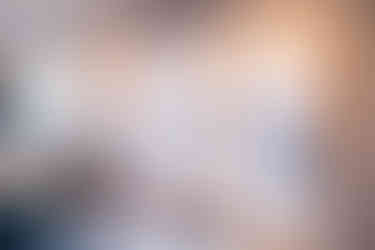 Three glass doors from new kitchen to deck in Two-Story Addition by Barrett Home Renovations