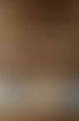 Close up of client's artifacts and art displayed on the stained oak floating cabinet and Floating Shelves Feature by Barrett Home Renovations