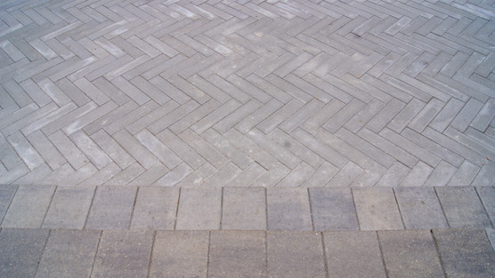 The top down view of rectangle steps contrasted with herringbone pavers