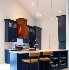 Quartzite peninsula now at proper bar height for seating includes built in book case