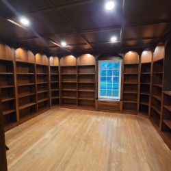 Custom installed lights in upper cases and coffered ceiling of new library