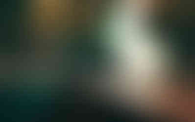 Soft glow of quartzite countertops in the Green Kitchen by Barrett Home Renovations